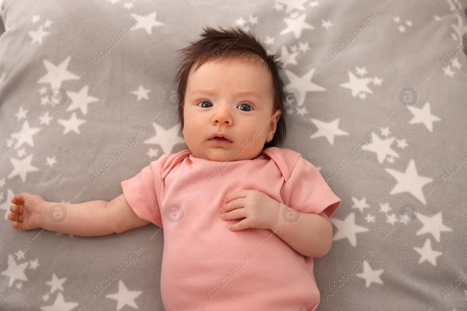 Photo of Time to sleep. Cute little baby lying on bed, top view