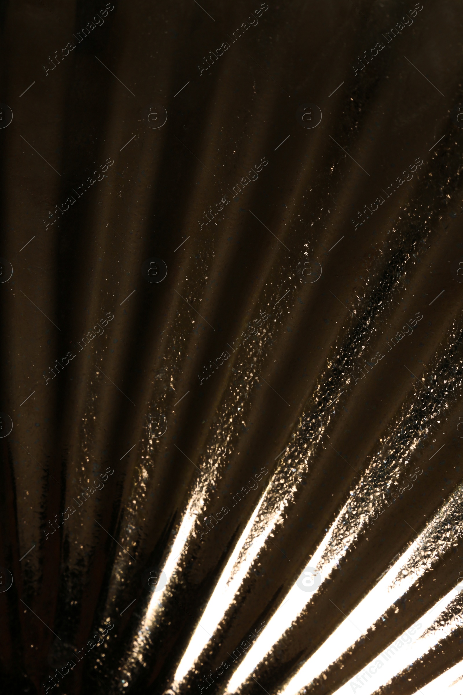 Photo of Corrugated golden texture as background, closeup view