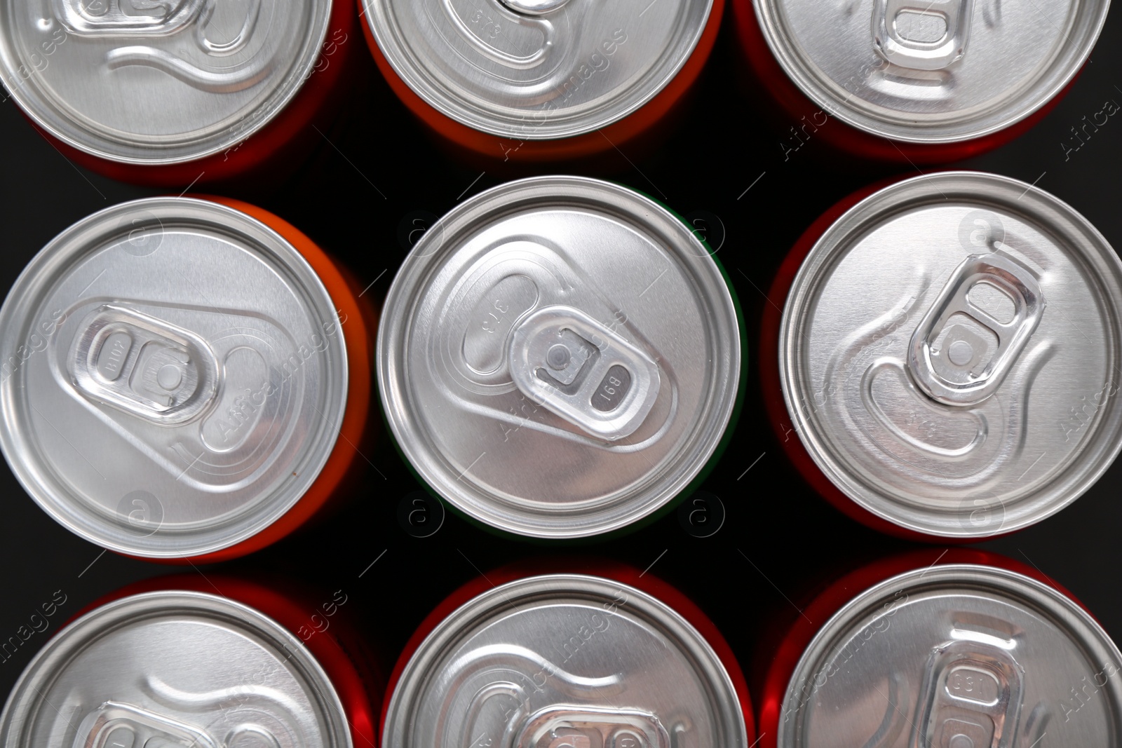 Photo of Energy drink in cans, top view. Functional beverage