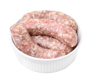 Photo of Raw homemade sausages in bowl isolated on white