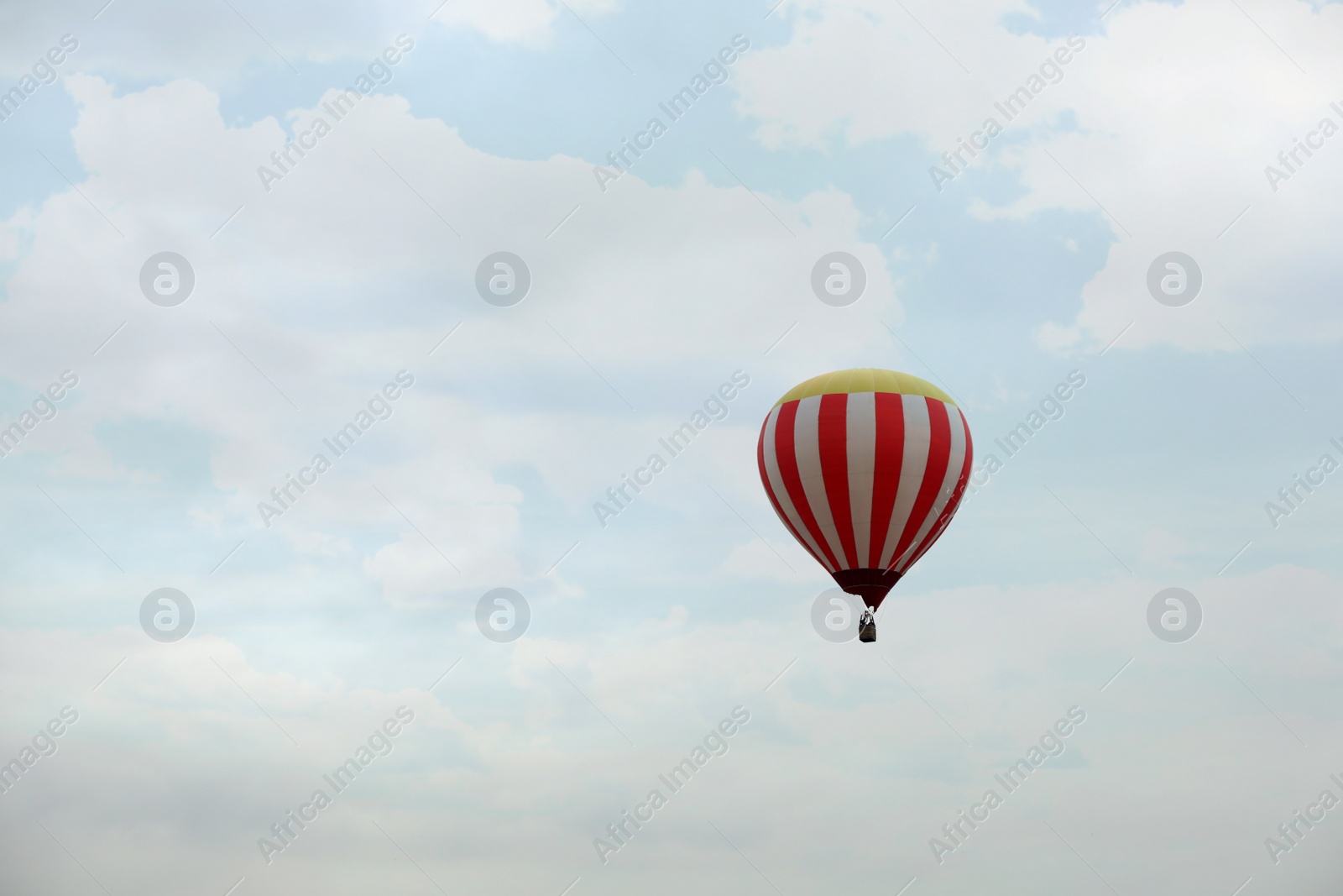 Photo of View of hot air balloon in blue sky, space for text