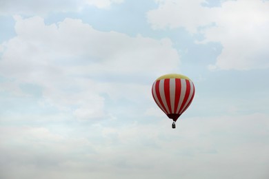 View of hot air balloon in blue sky, space for text