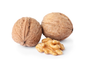 Photo of Walnuts in shell and kernel on white background. Organic snack