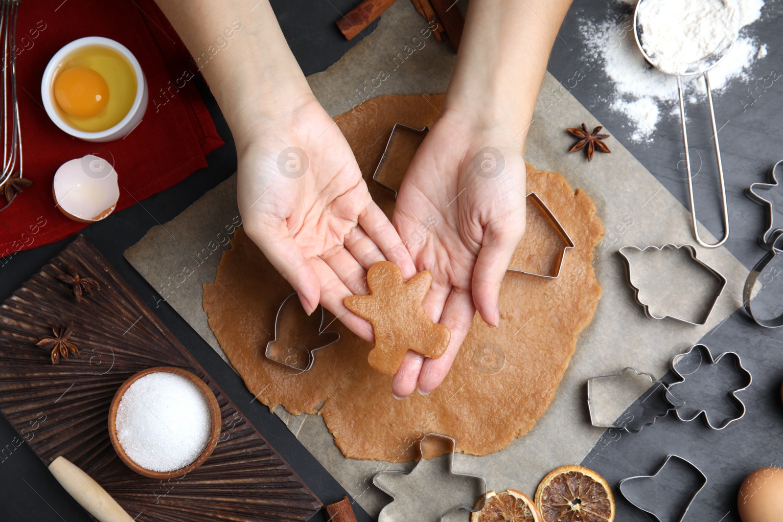 Photo of Woman making Christmas cookies at table, top view