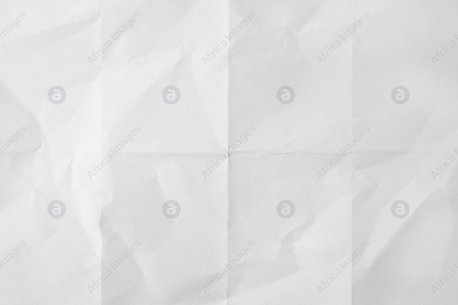 Photo of Sheet of folded white paper as background, top view