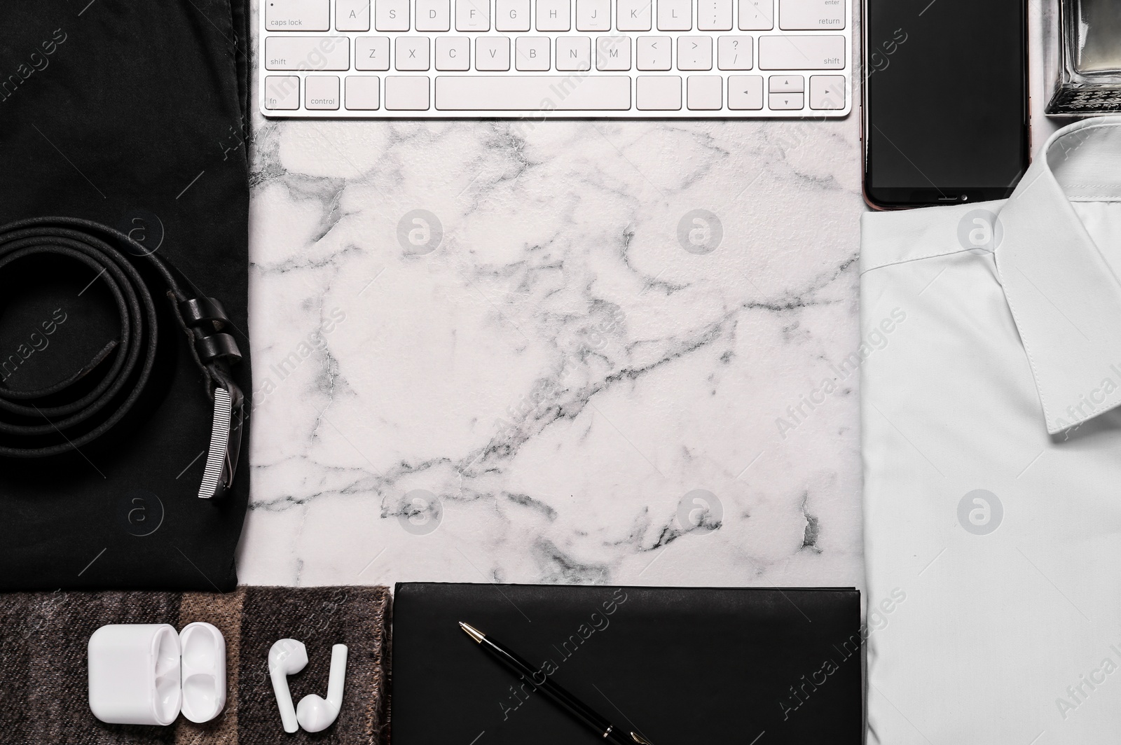 Photo of Frame of stylish clothes, gadgets and accessories on white marble background, flat lay. Space for text