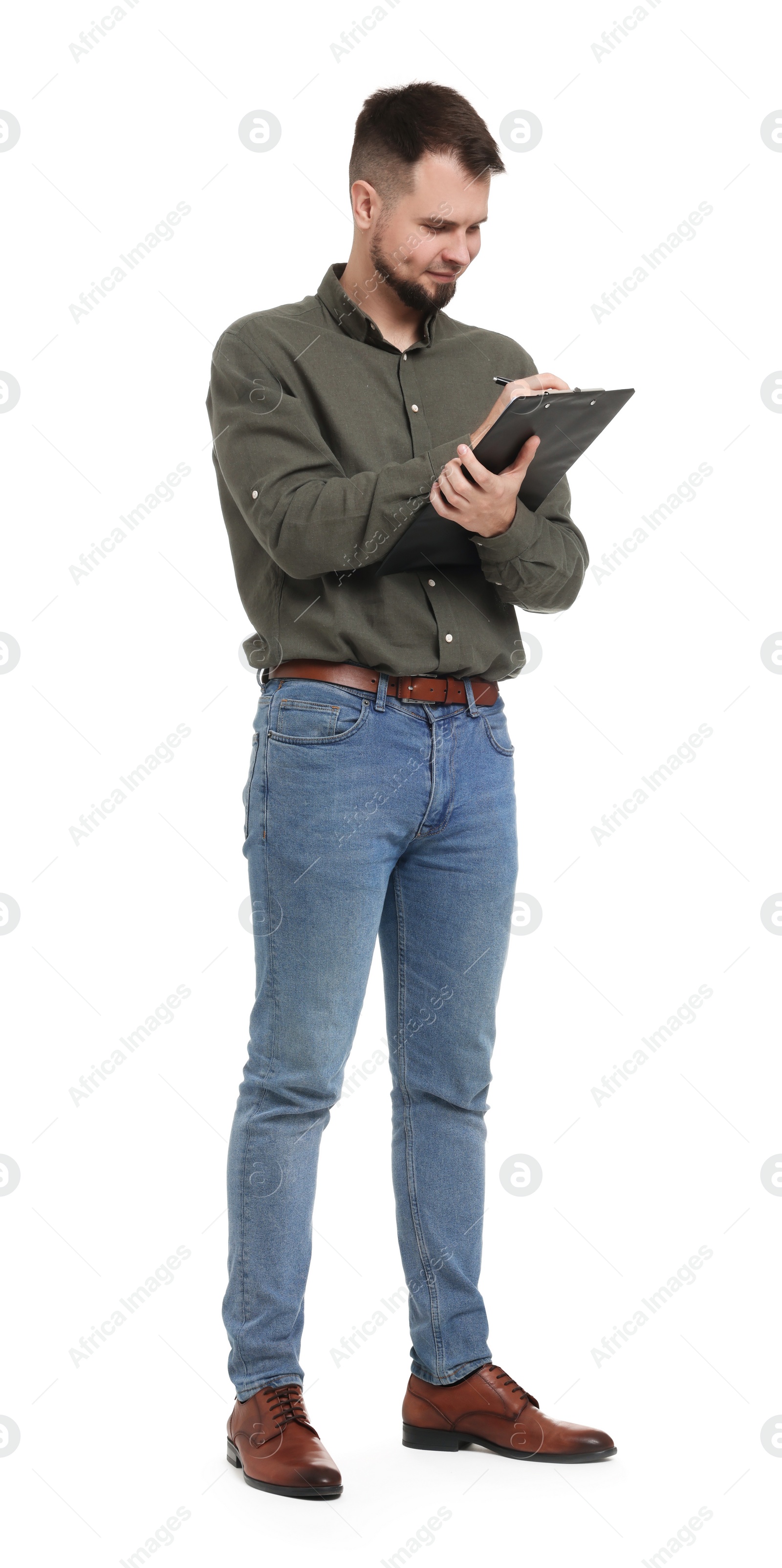 Photo of Man in shirt and jeans with clipboard on white background