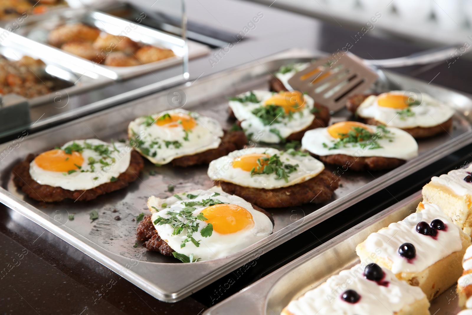 Photo of Trays with healthy food in school canteen