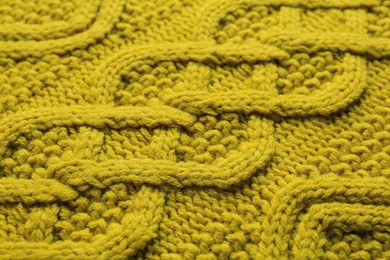 Photo of Knitted fabric with beautiful pattern as background, closeup