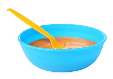 Tasty baby food and spoon in bowl isolated on white