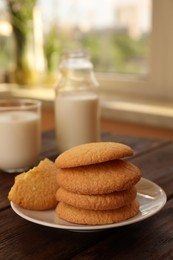 Photo of Delicious Danish butter cookies on wooden table, closeup