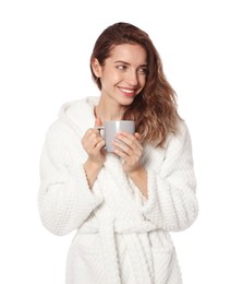 Beautiful woman with cup of coffee wearing bathrobe on white background