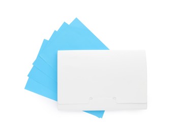 Photo of Package of facial oil blotting tissues on white background, top view. Mattifying wipes