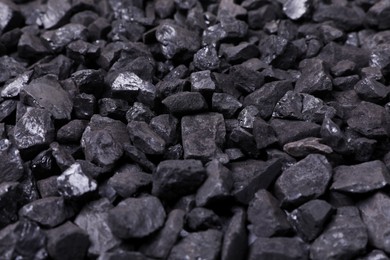 Photo of Pieces of black coal as background, closeup