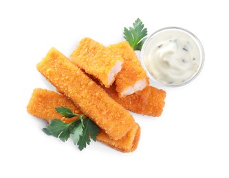 Photo of Fresh breaded fish fingers with parsley and sauce on white background, top view