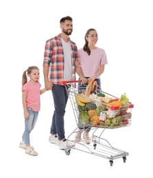 Happy family with shopping cart full of groceries on white background