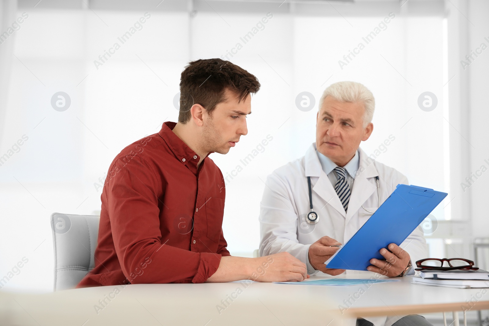 Photo of Man with health problems visiting urologist at hospital