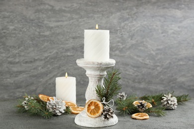 Photo of Christmas composition with wooden candlestick on table