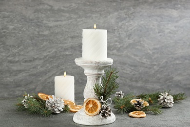 Christmas composition with wooden candlestick on table