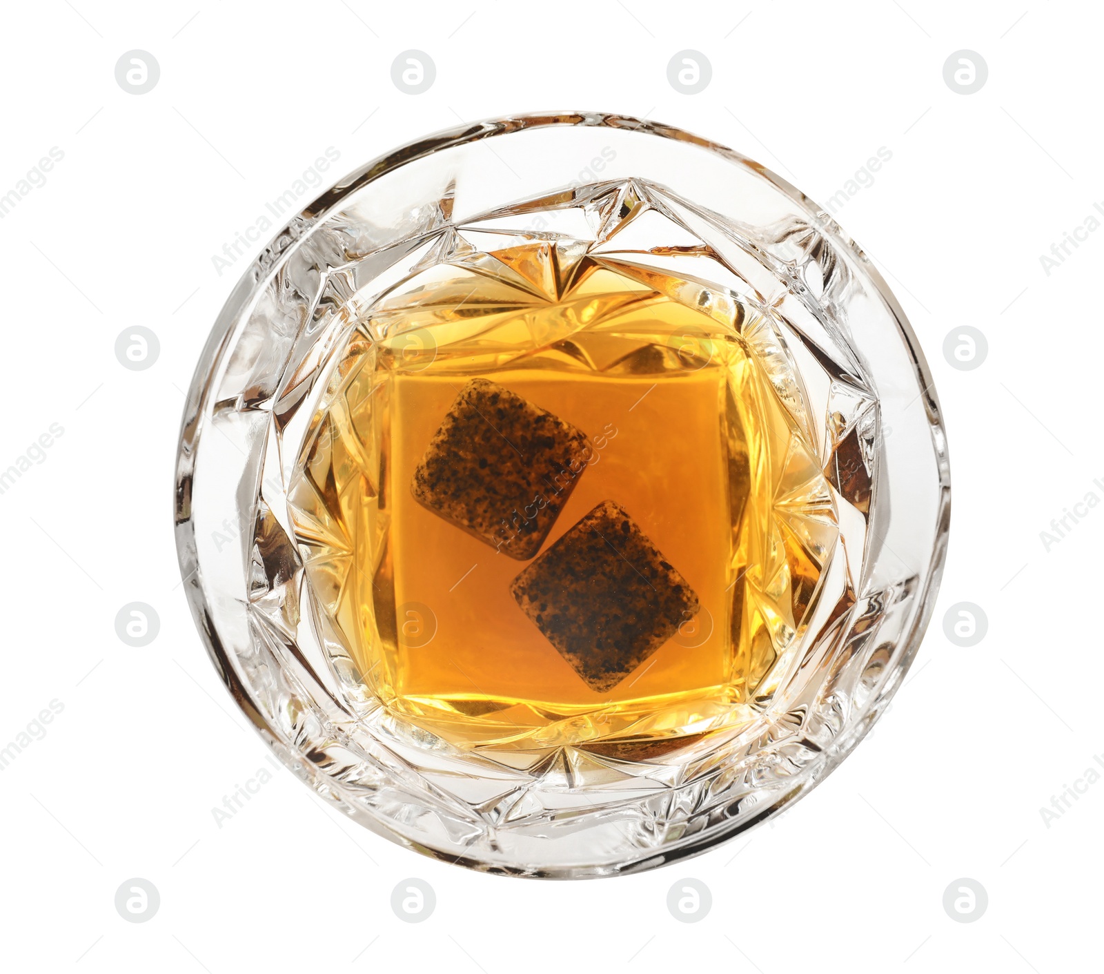 Photo of Glass of expensive whiskey with stones on white background, top view