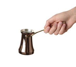 Photo of Woman holding copper turkish coffee pot on white background, closeup