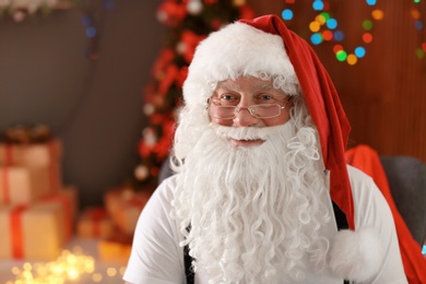 Authentic Santa Claus with bushy beard indoors