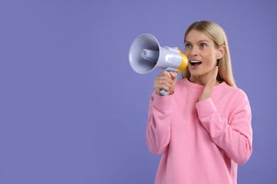 Photo of Special promotion. Woman shouting in megaphone on purple background. Space for text