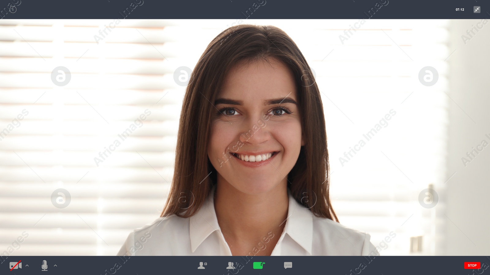 Image of Woman communicating with coworkers from home using video chat, view through camera