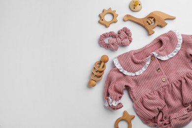 Photo of Flat lay composition with baby clothes and accessories on white background, space for text