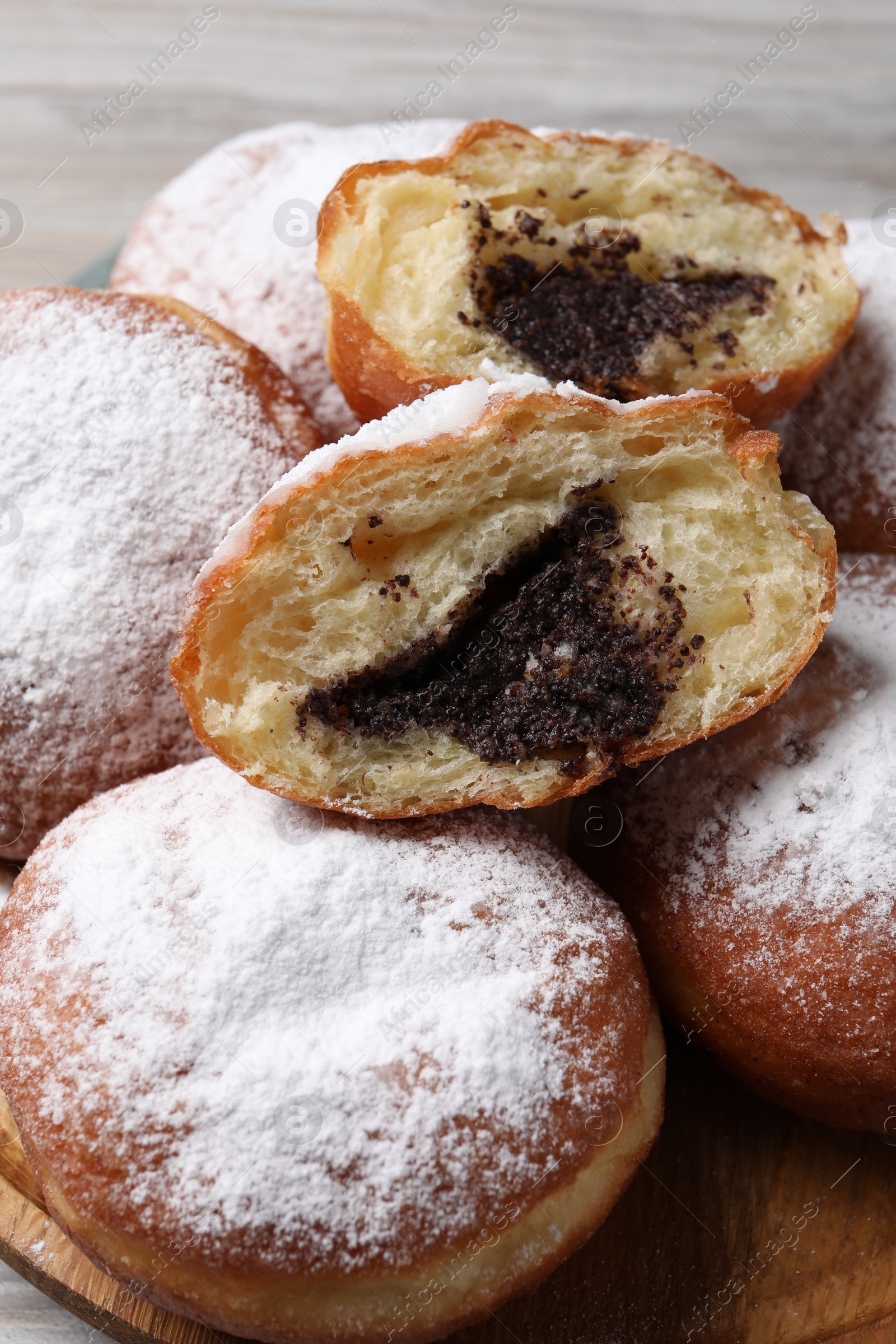 Photo of Delicious sweet buns with poppy seeds on table, closeup