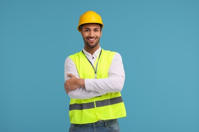 Engineer in hard hat on light blue background