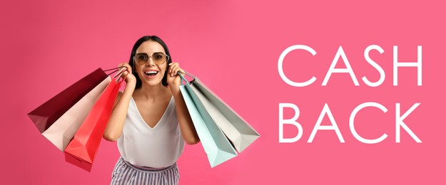 Image of Beautiful woman with paper shopping bags and words Cash Back on pink background. Banner design