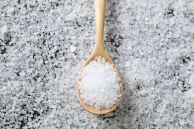 Natural salt and wooden spoon, top view