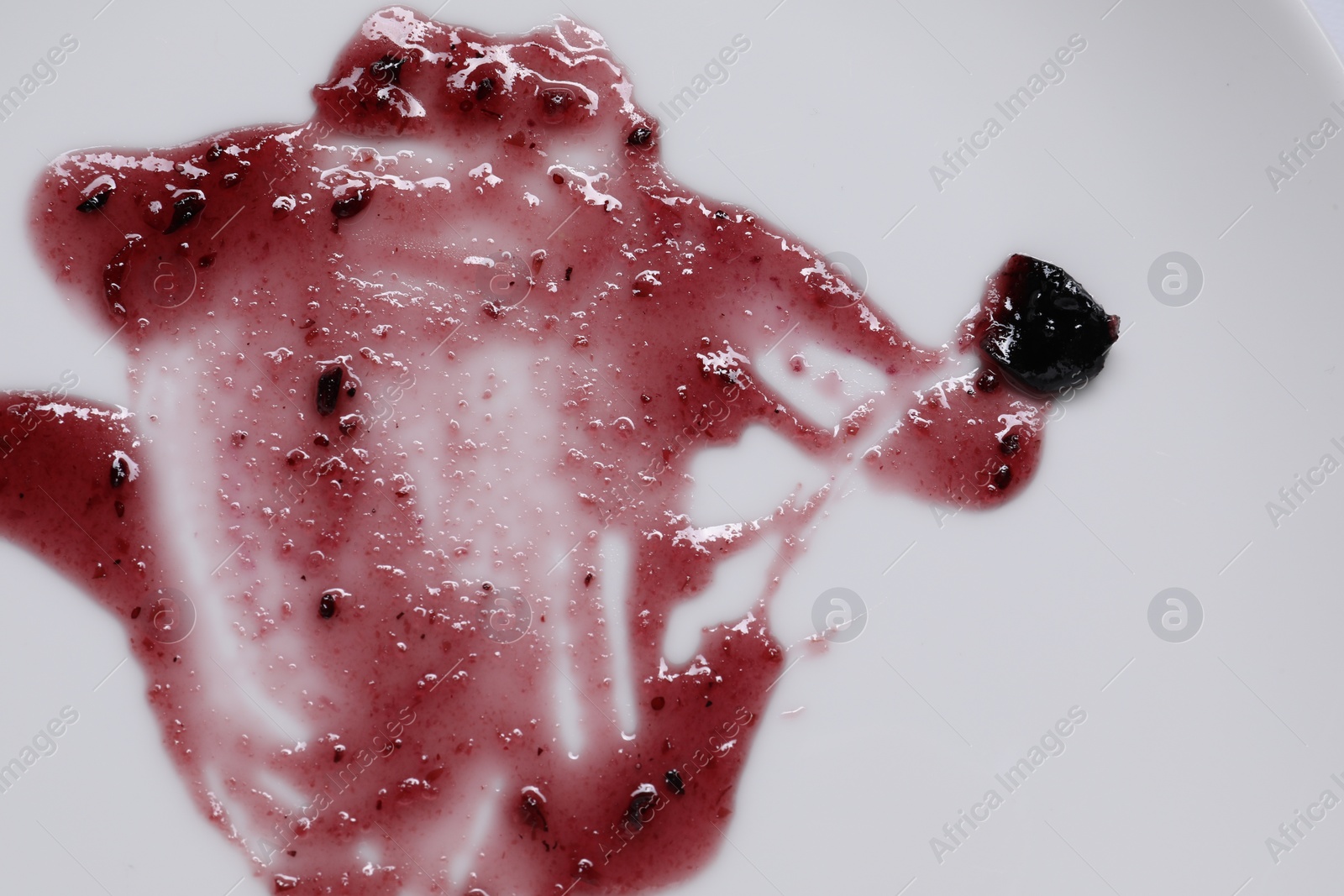 Photo of Smear of sauce on white background, top view