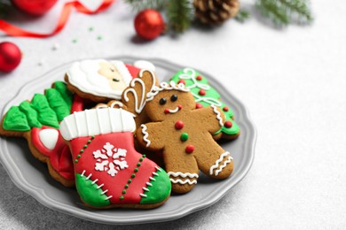 Tasty homemade Christmas cookies on light grey table. Space for text
