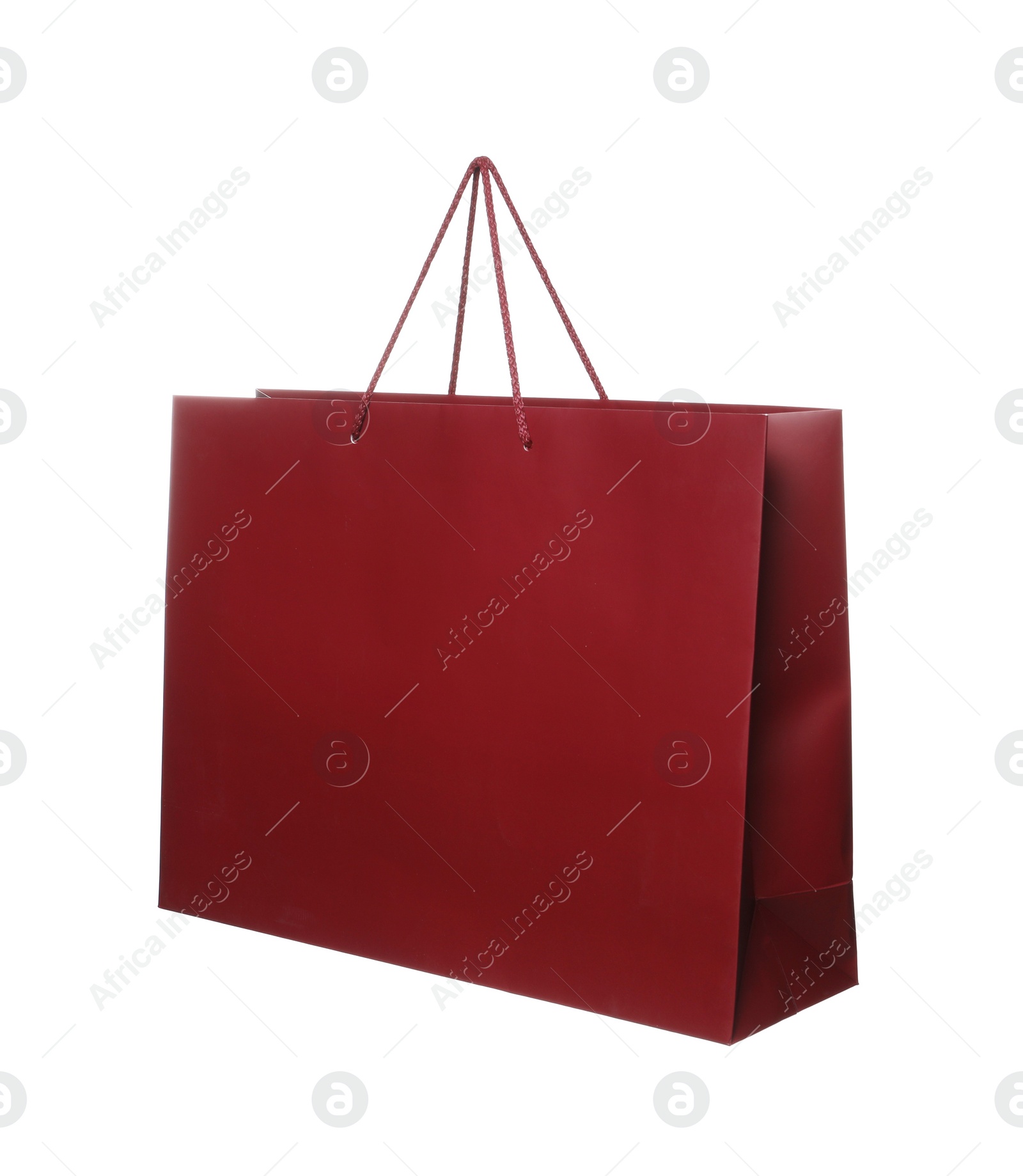 Photo of One dark red shopping bag isolated on white