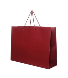 Photo of One dark red shopping bag isolated on white