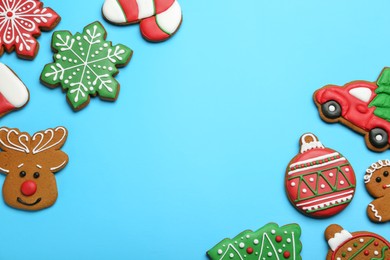 Photo of Different tasty Christmas cookies on light blue background, flat lay. Space for text