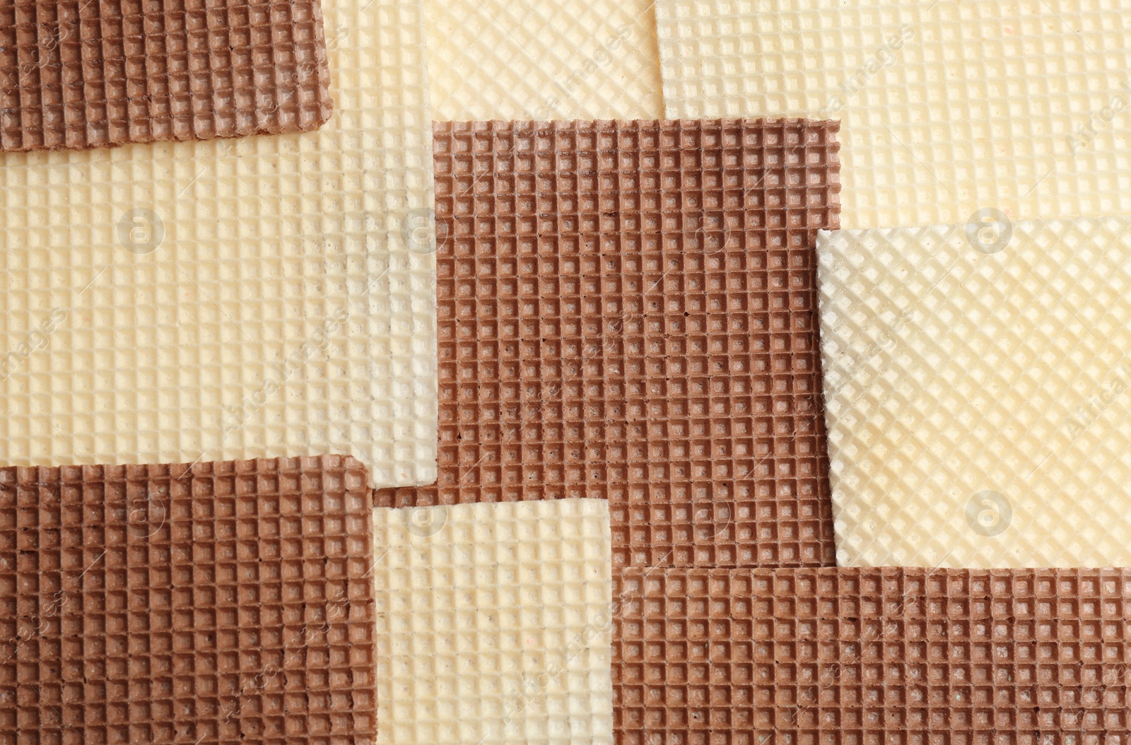 Photo of Tasty wafers as background, closeup. Crispy food