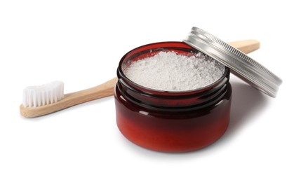 Jar of tooth powder and brush on white background