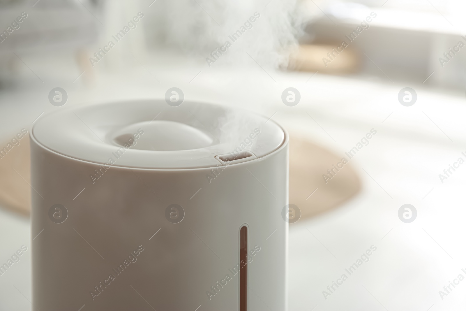 Photo of Modern humidifier indoors, closeup view. Home appliance