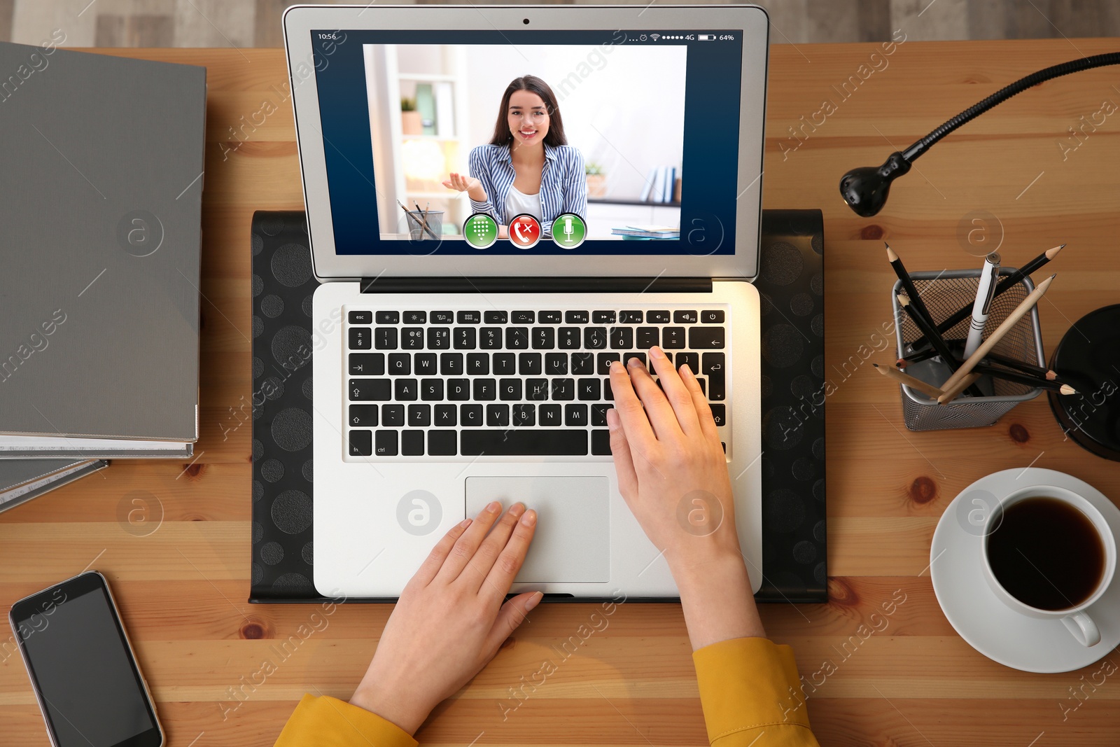 Image of Distance learning, online school lesson. Girl studying at home during quarantine and lockdown due to Covid-19 pandemic, top view