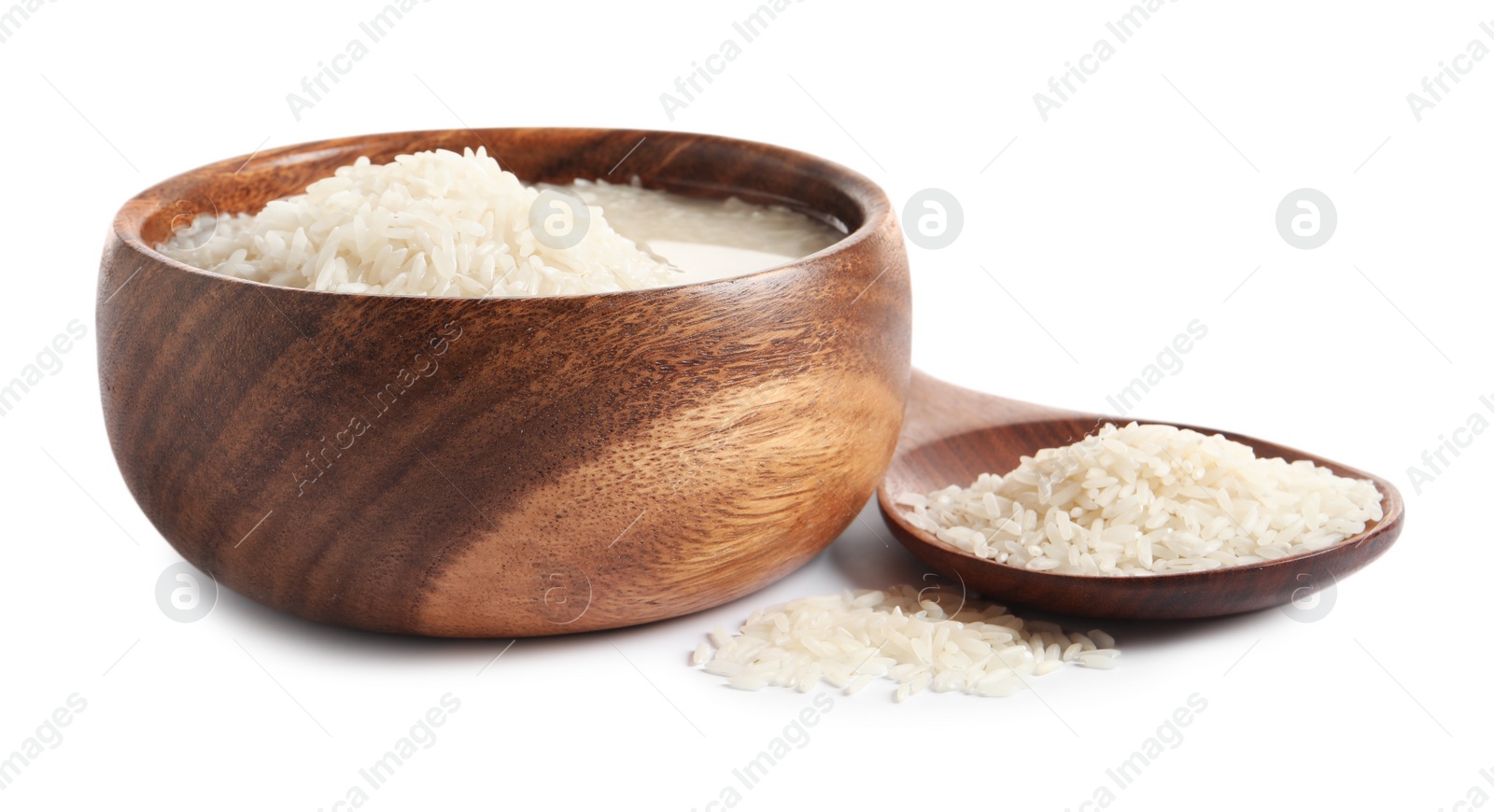 Photo of Rice soaked in water on white background