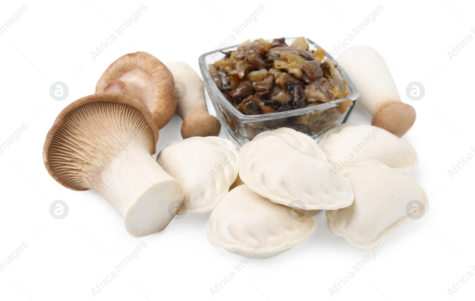 Photo of Raw dumplings (varenyky) and cooked mushrooms isolated on white
