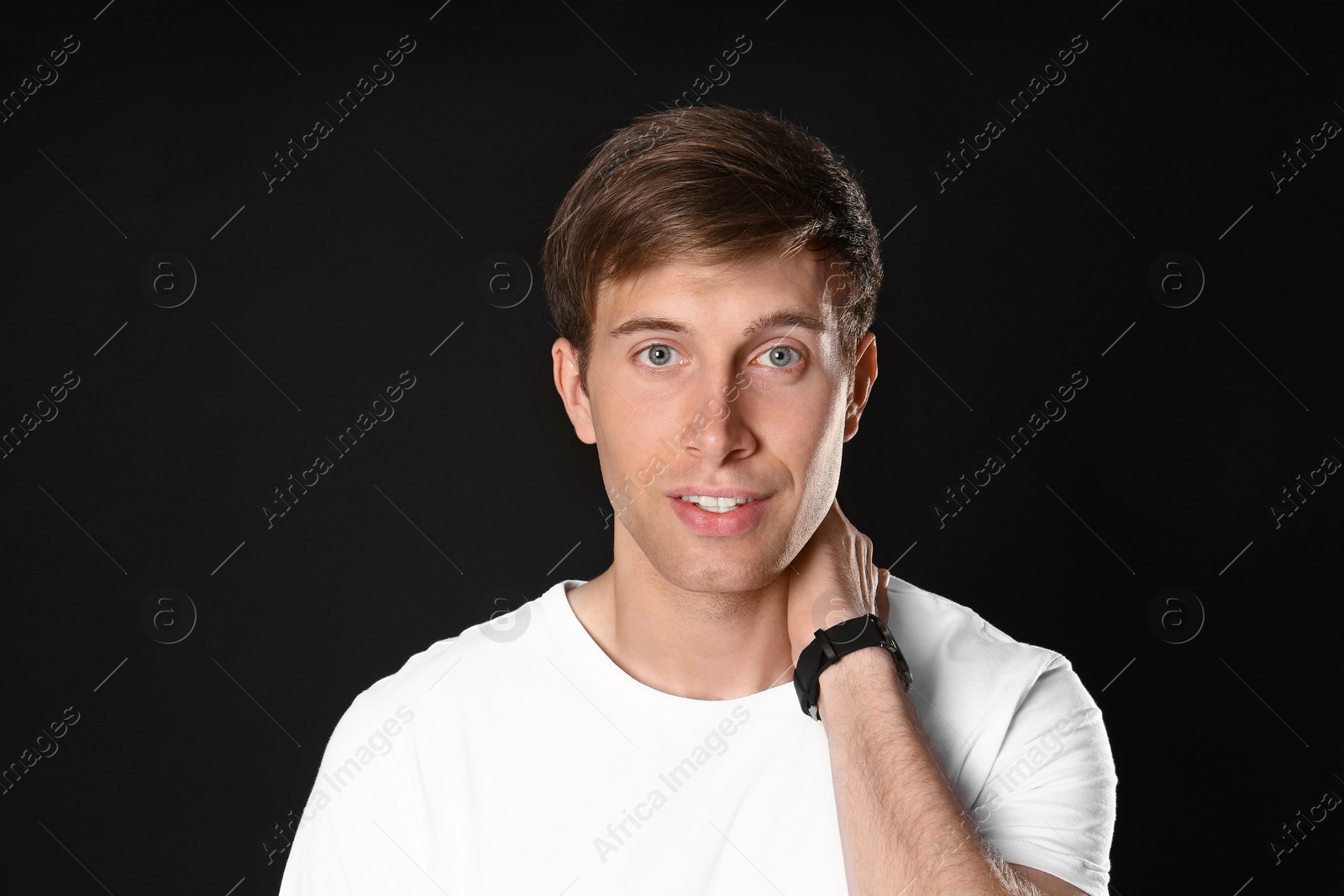 Photo of Portrait of handsome man on black background