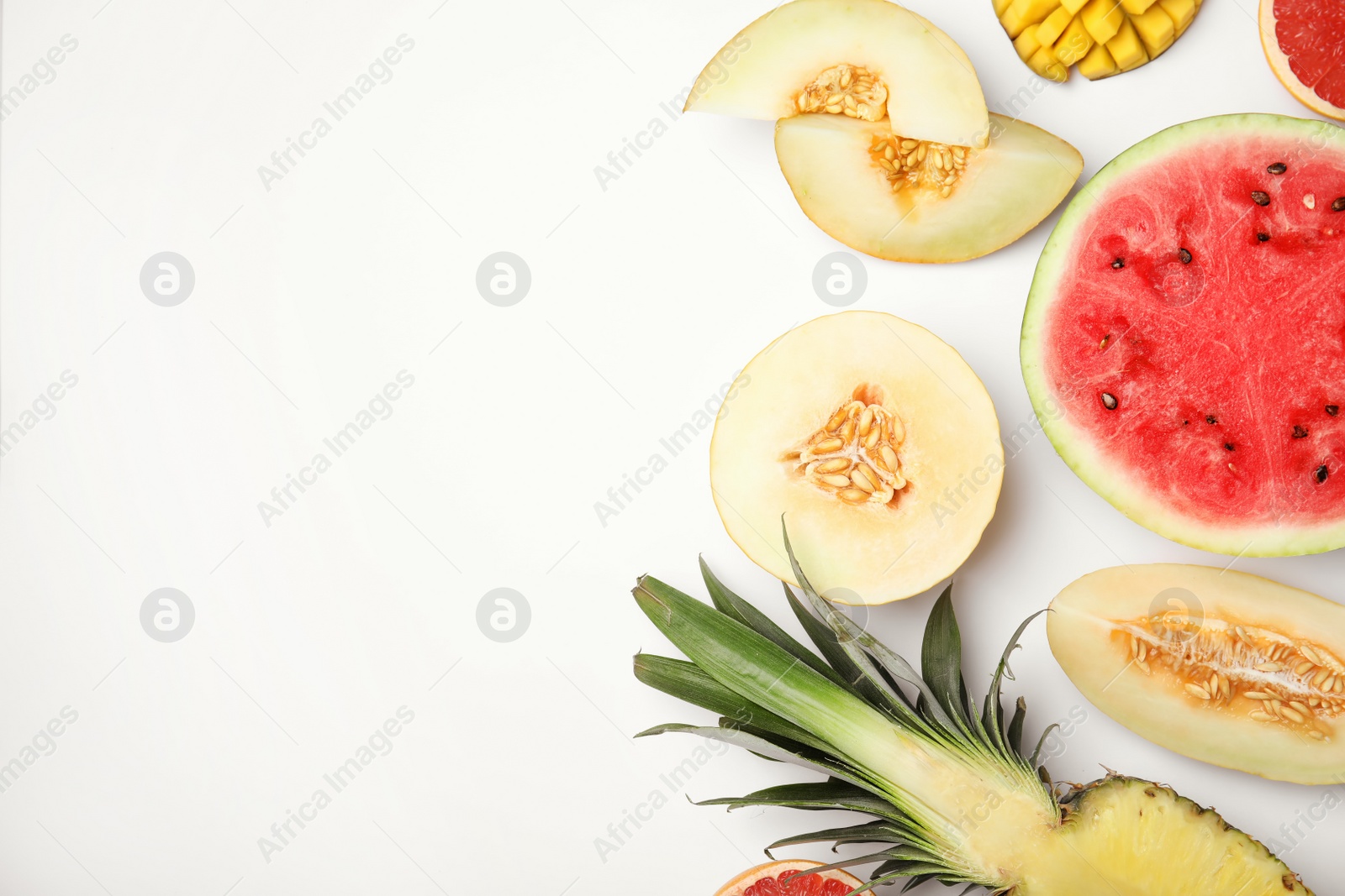 Photo of Flat lay composition with melon, other fruits and space for text on white background