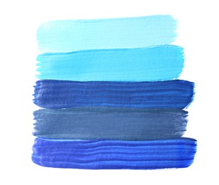 Samples of different paints on white background, top view