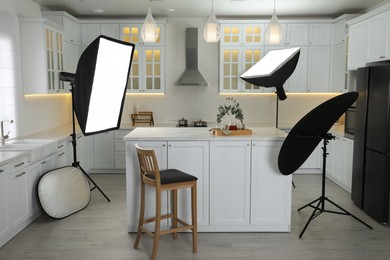 Photo of Professional photo studio equipment prepared for shooting kitchen interior