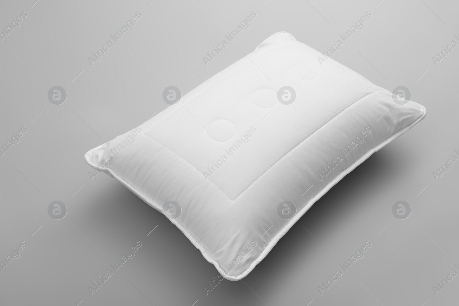 Photo of Clean soft bed pillow on grey background