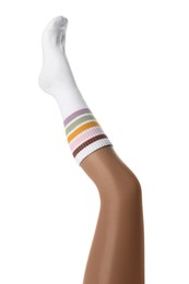 Photo of Woman wearing color sock on white background, closeup